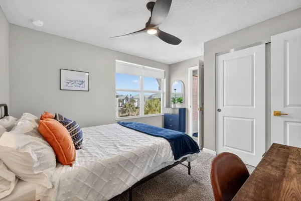 a bedroom with a bed and a dresser
