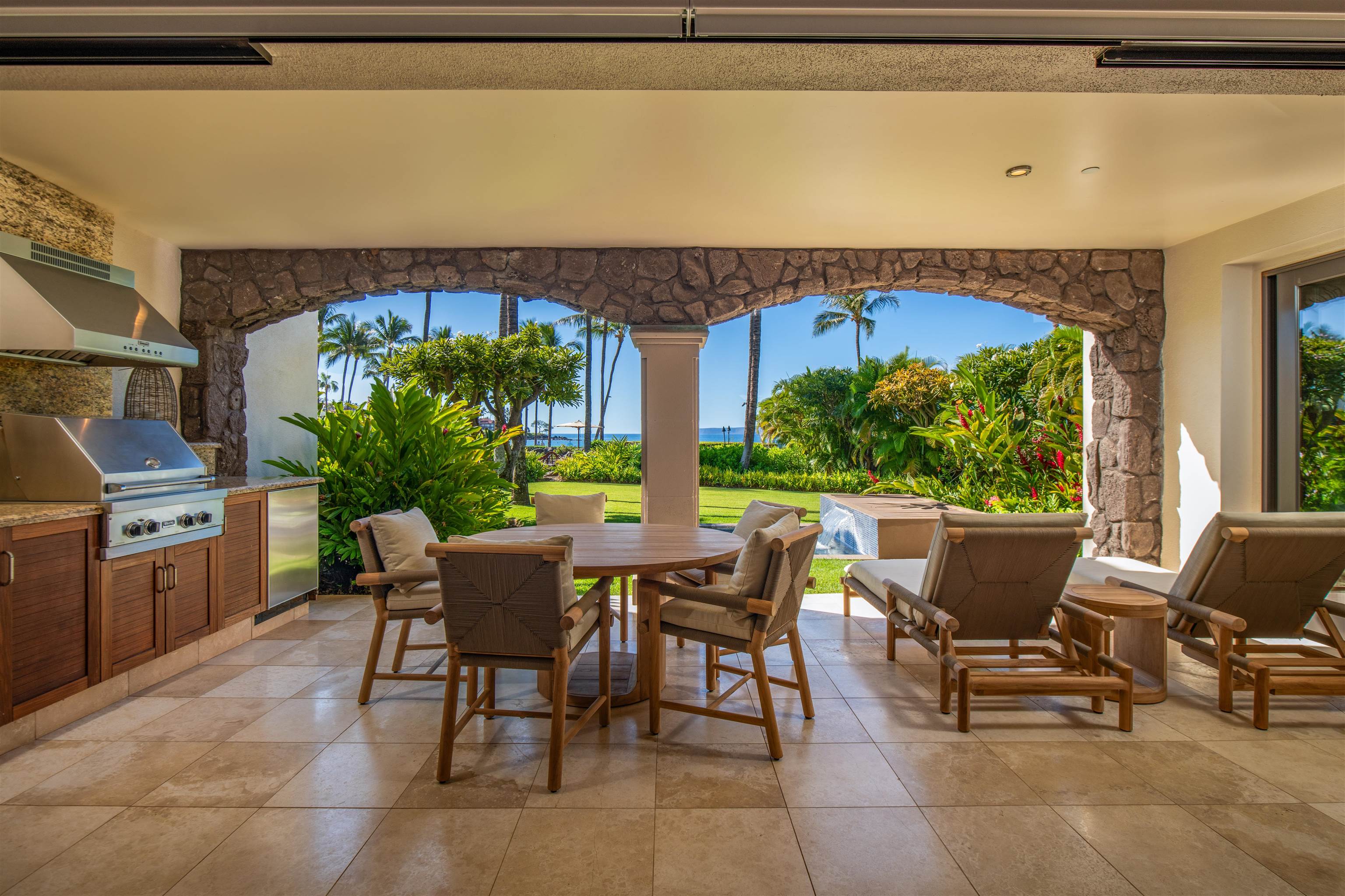 3800 Wailea Alanui Drive, Unit B101 Kihei, HI 96753 - Photo 13 of 50 a view of a patio with table and chairs potted plants