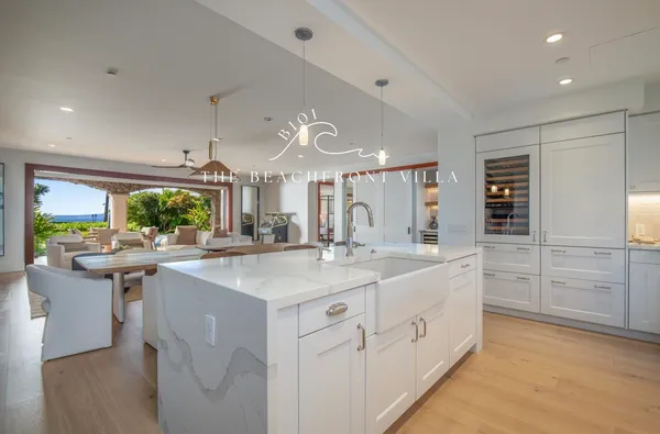 a kitchen with counter top space sink and center island