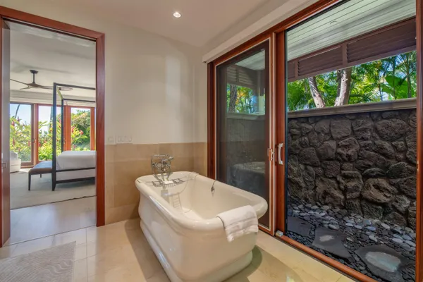 a bathroom with a bathtub and shower