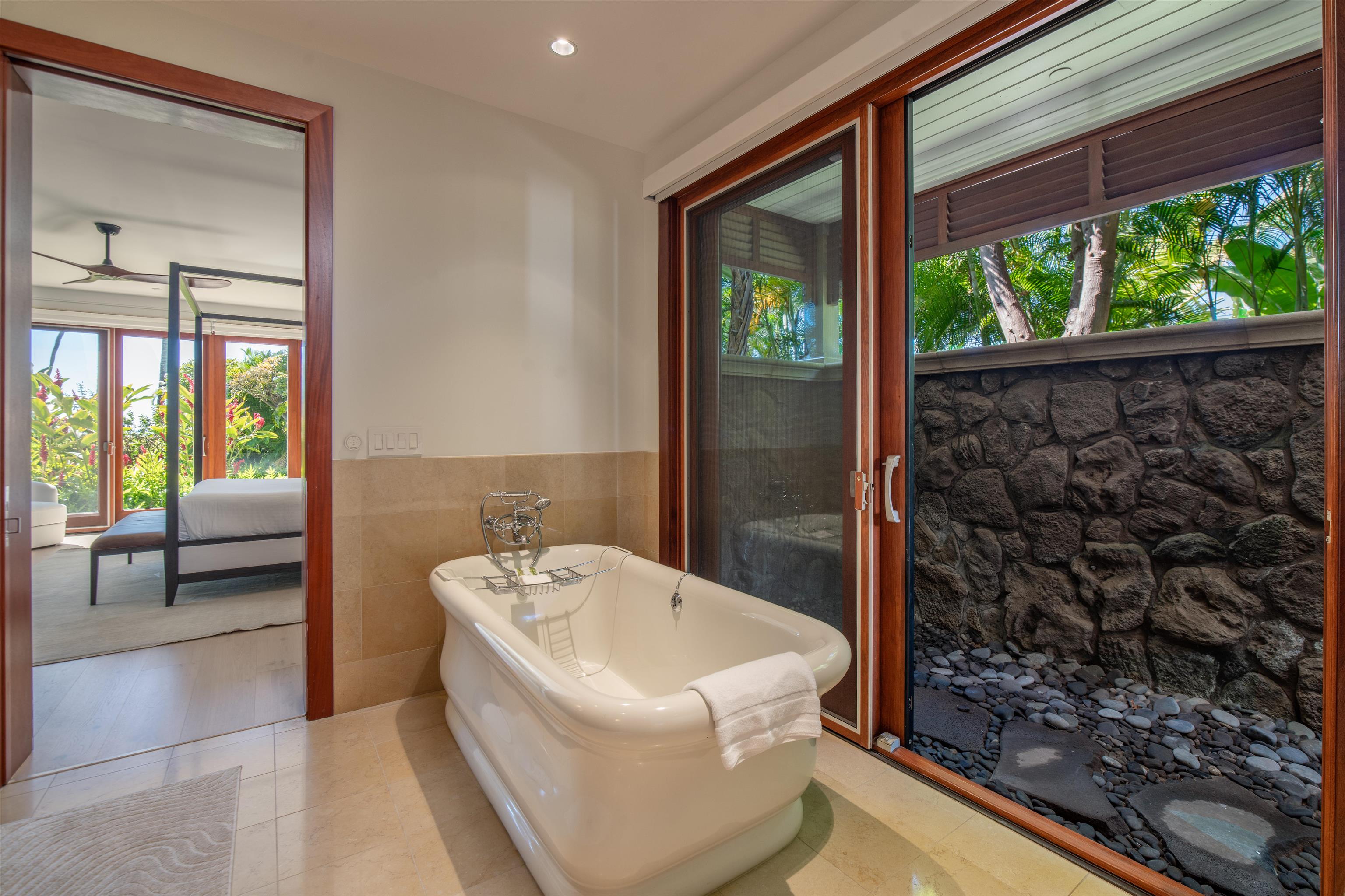3800 Wailea Alanui Drive, Unit B101 Kihei, HI 96753 - Photo 23 of 50 a bathroom with a bathtub and shower