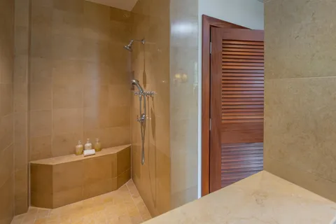 a bathroom with a bathtub and shower