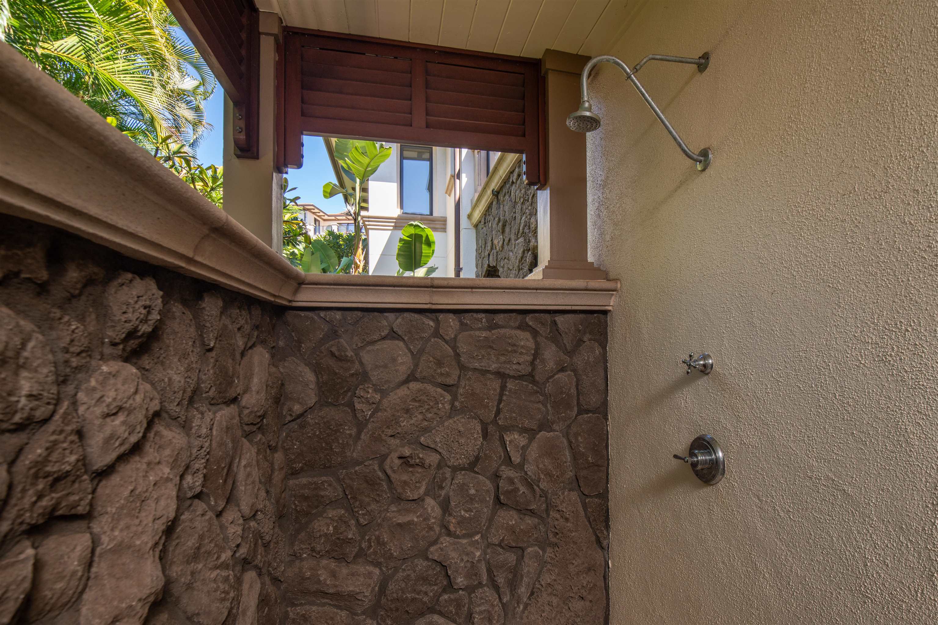 3800 Wailea Alanui Drive, Unit B101 Kihei, HI 96753 - Photo 36 of 50 a bathroom with a sink and mirror