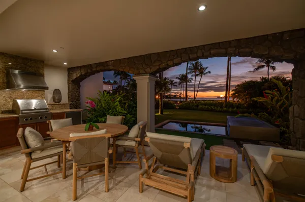 a view of a chairs and tables in patio
