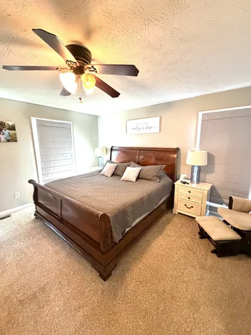 a bedroom with a bed and window