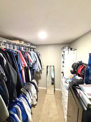 a view of a hallway view with wooden floor and staircase