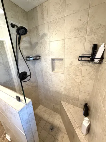 a bathroom with a toilet a sink and a window