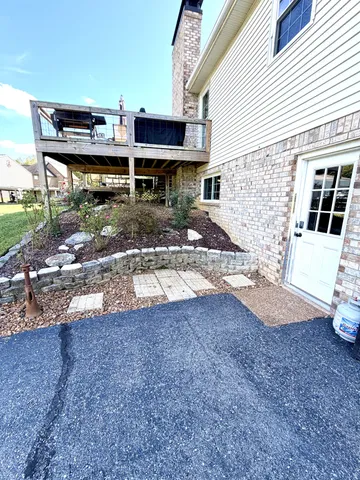 a view of a swimming pool and a yard
