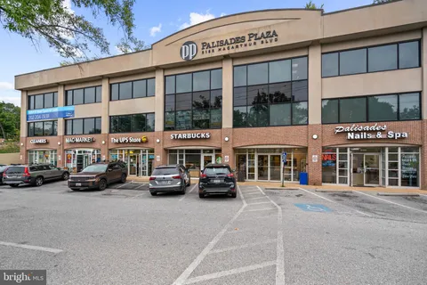 a view of a street that has couple of cars parked on the road