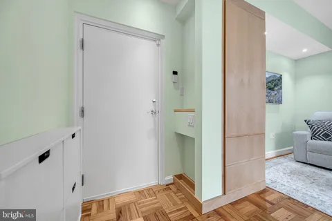 a view of bedroom with hardwood floor and bathroom