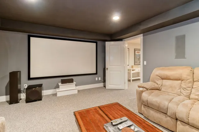 a living room with furniture gym equipment and large window