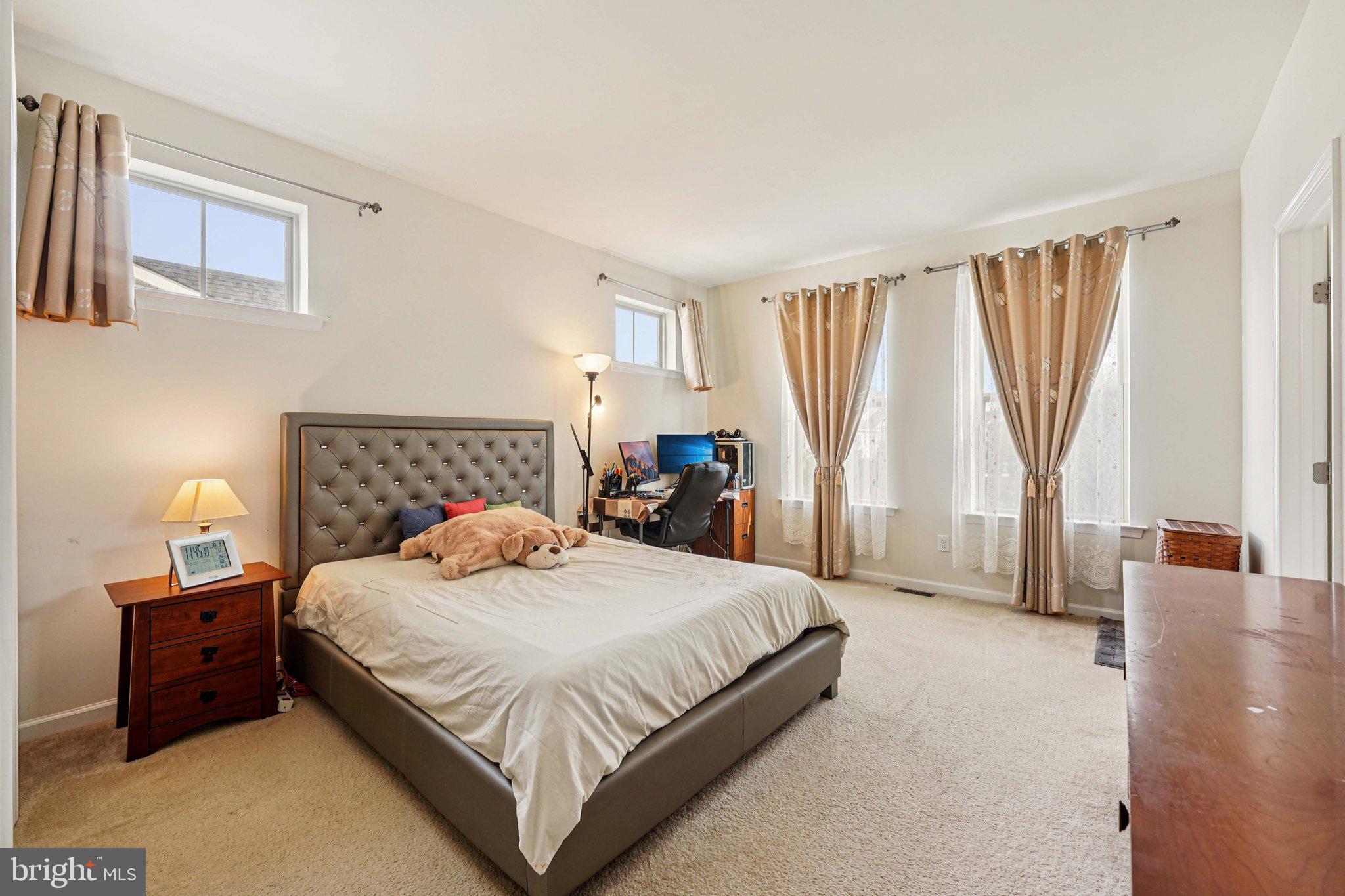 332 Redbud Lane Kennett Square, PA 19348 - Photo 12 of 29 a bedroom with a bed and a couch