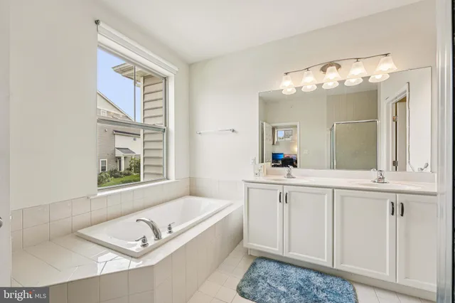 a living room with granite countertop furniture and a chandelier
