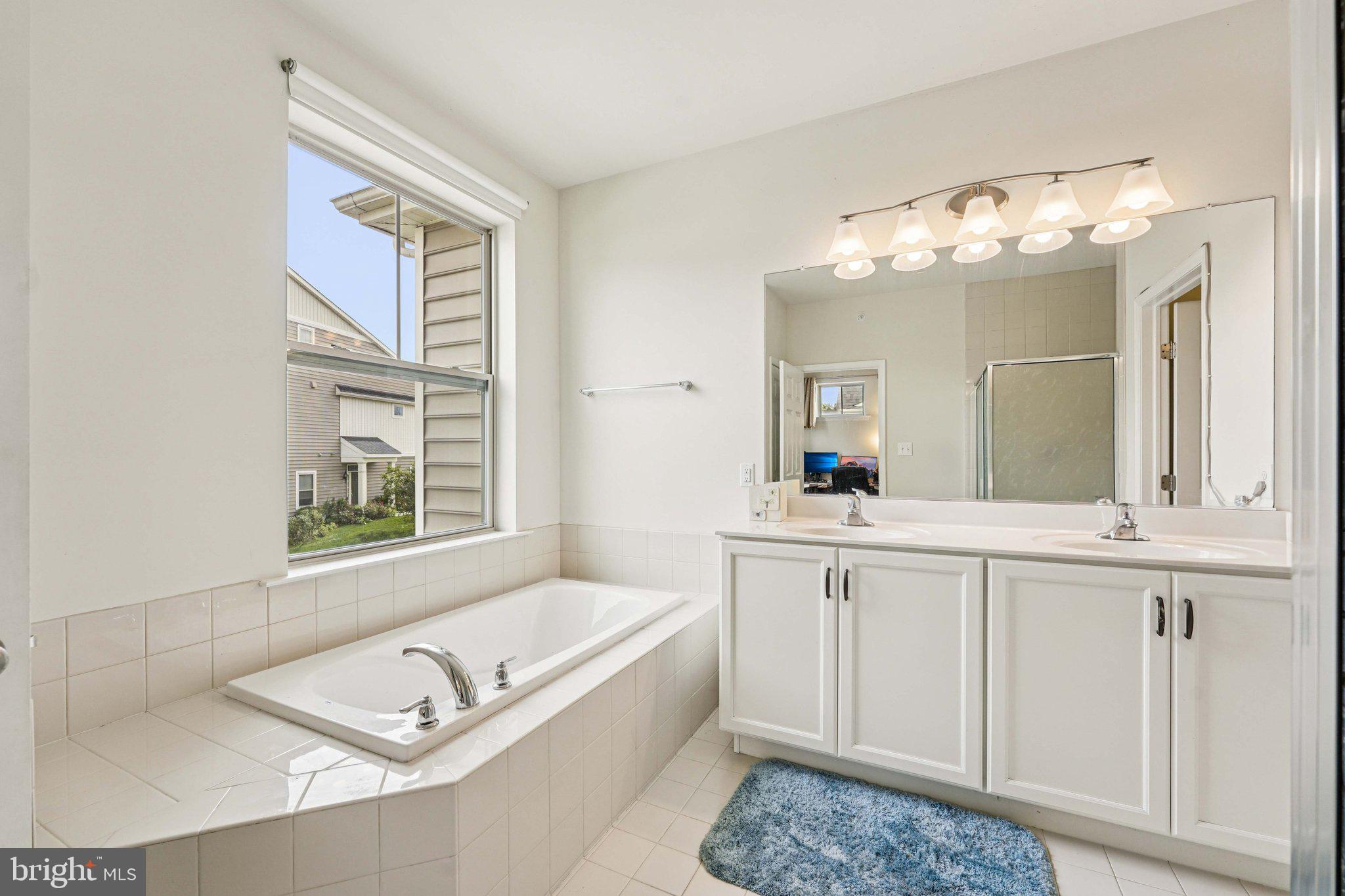 332 Redbud Lane Kennett Square, PA 19348 - Photo 15 of 29 a living room with granite countertop furniture and a chandelier