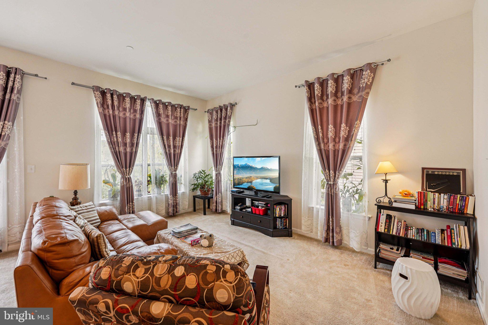 332 Redbud Lane Kennett Square, PA 19348 - Photo 6 of 29 a bedroom with a bed closet and a flat tv screen