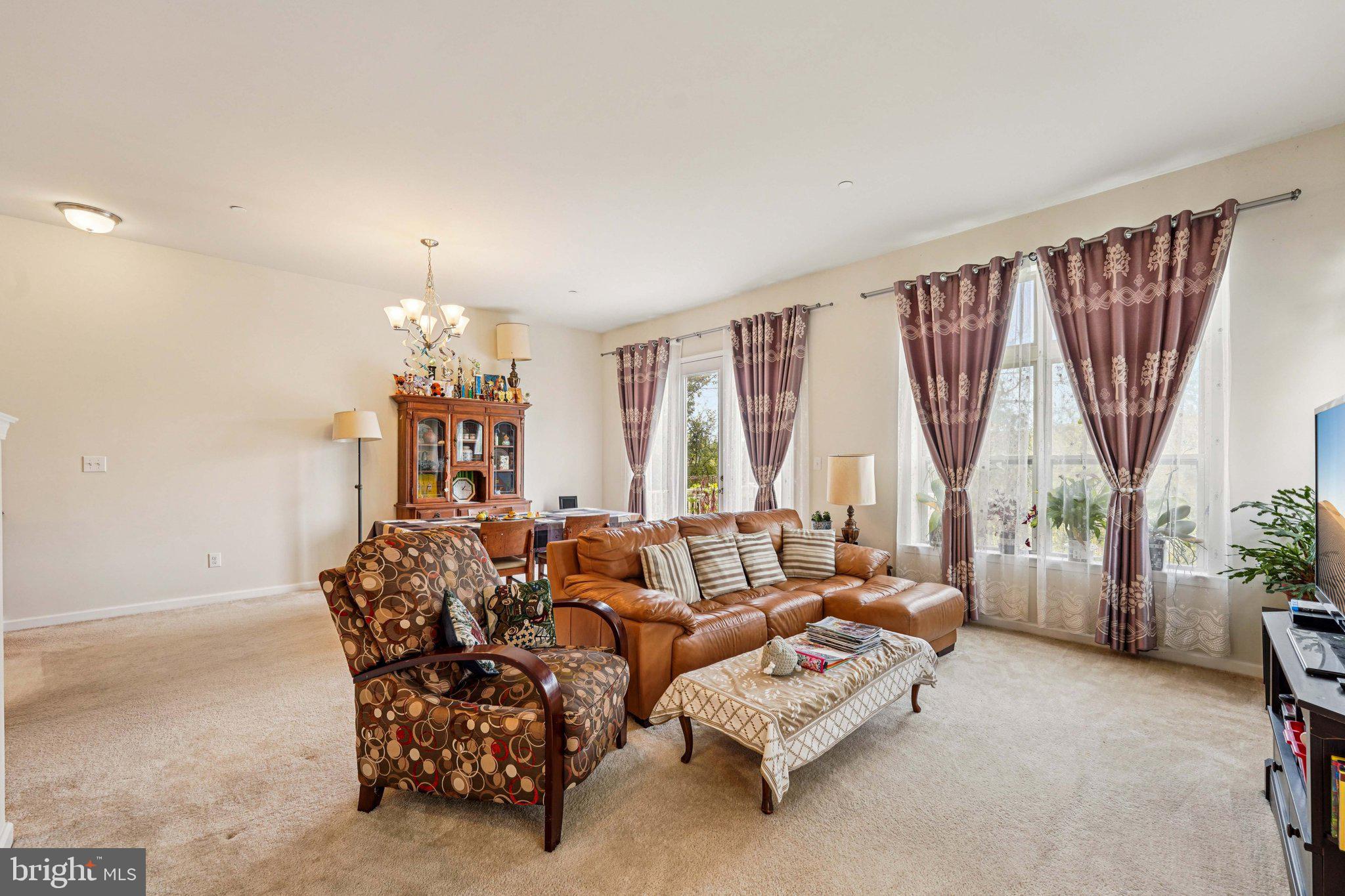 332 Redbud Lane Kennett Square, PA 19348 - Photo 7 of 29 a spacious bedroom with furniture and a large window