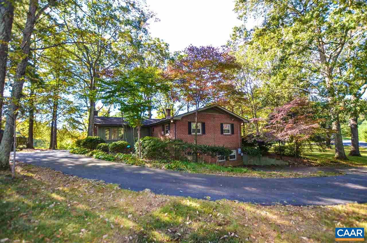 5770 Willow Spring Road Crozet, VA 22932 - Photo 11 of 49 a view of a yard in front of a house with large trees