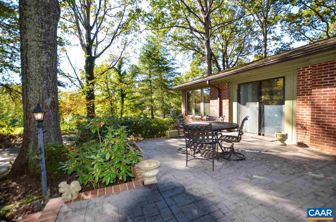 5770 Willow Spring Road Crozet, VA 22932 - Photo 13 of 49 a view of a patio with table and chairs and potted plants