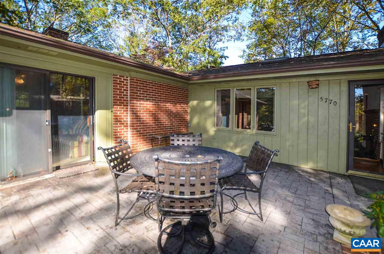 5770 Willow Spring Road Crozet, VA 22932 - Photo 15 of 49 a view of a patio with table and chairs