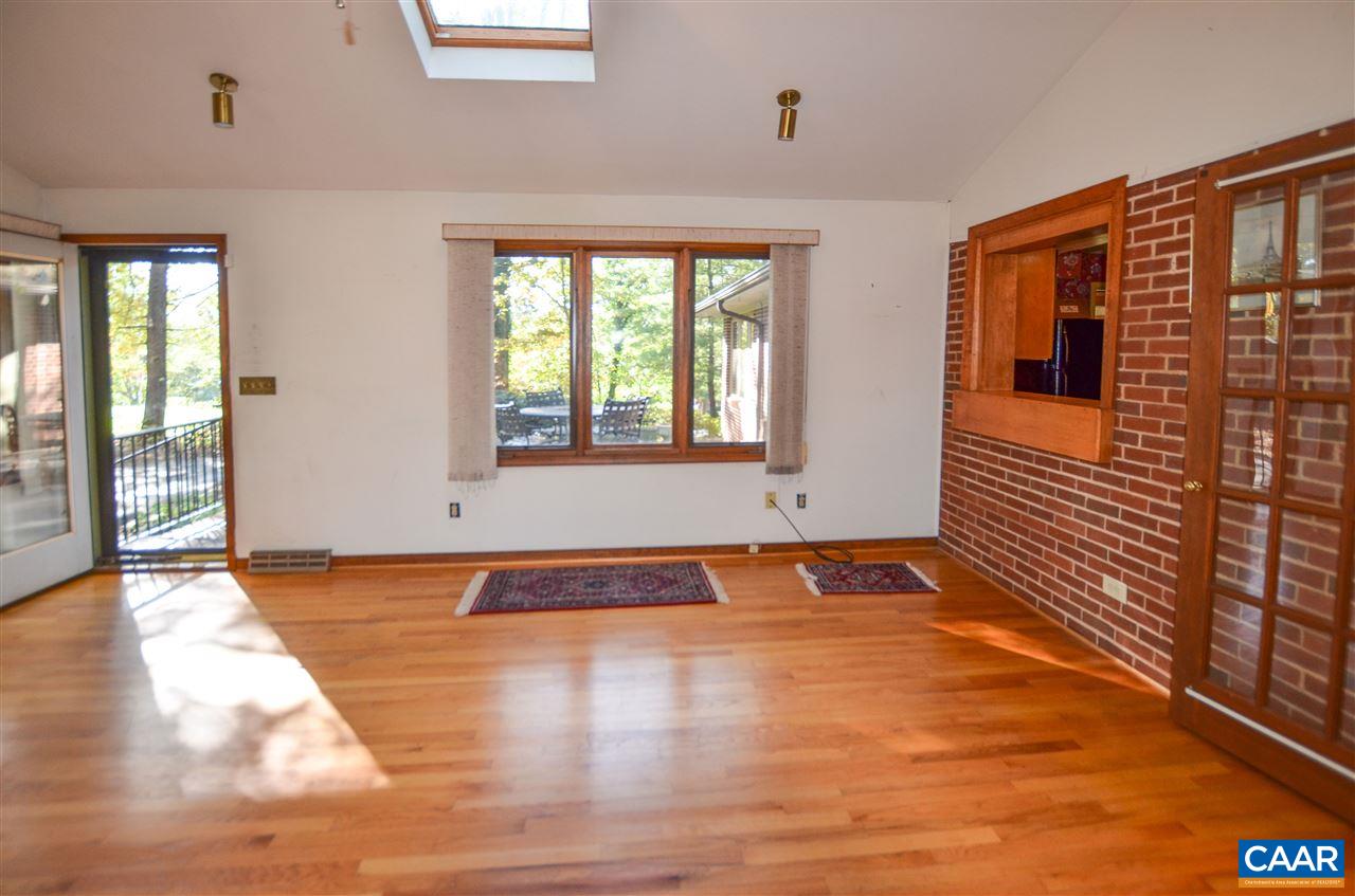 5770 Willow Spring Road Crozet, VA 22932 - Photo 16 of 49 a view of an empty room with wooden floor and a window