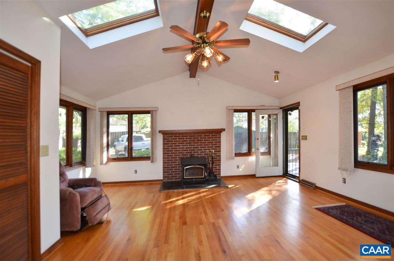 5770 Willow Spring Road Crozet, VA 22932 - Photo 17 of 49 a living room with fireplace furniture and a wooden floor