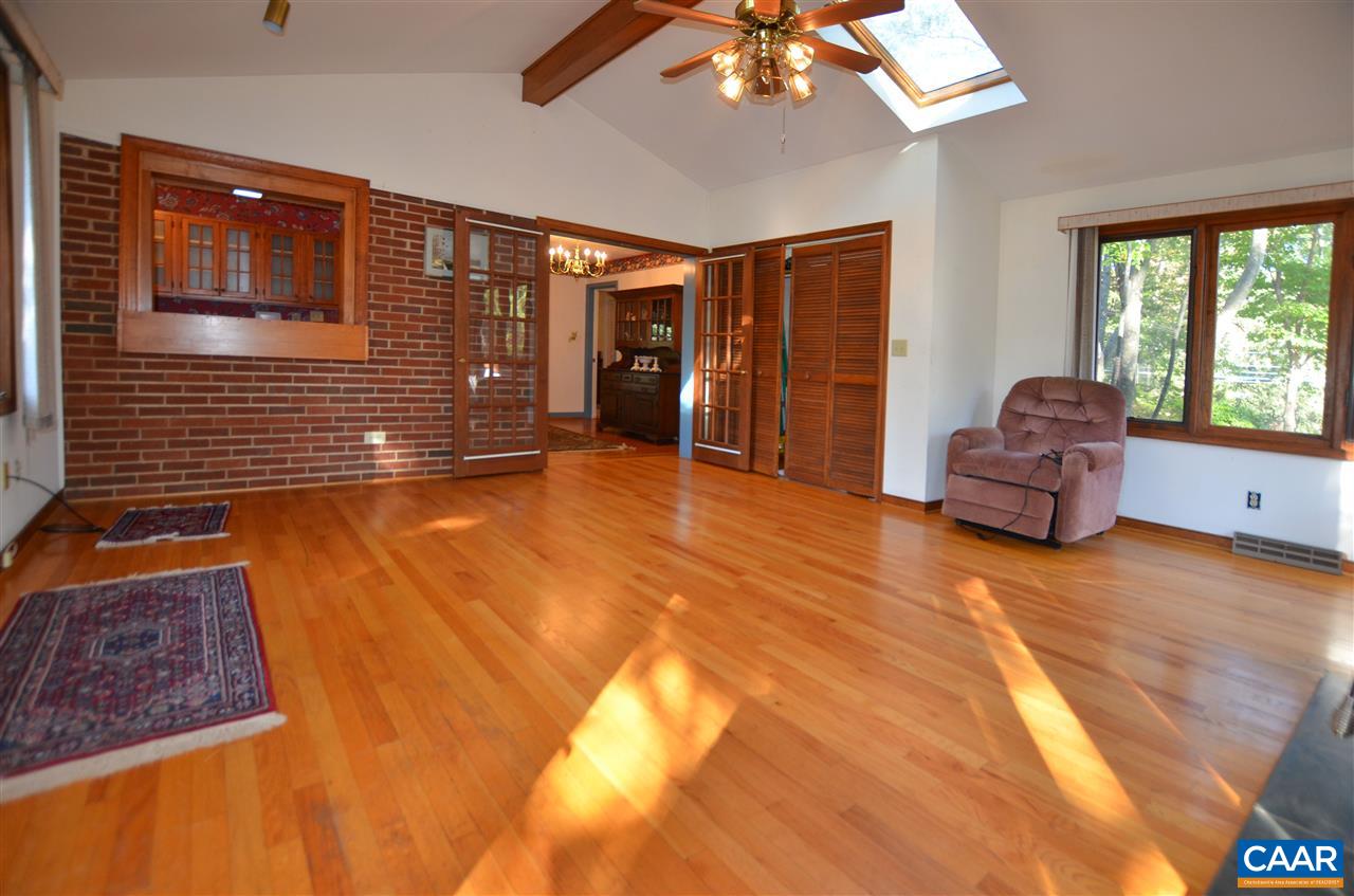 5770 Willow Spring Road Crozet, VA 22932 - Photo 19 of 49 a living room with furniture and large windows