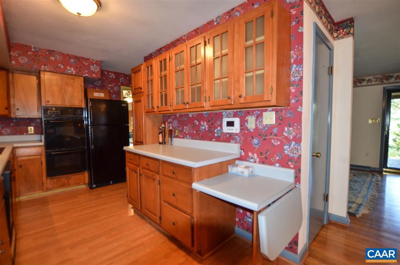 5770 Willow Spring Road Crozet, VA 22932 - Photo 21 of 49 a kitchen with a stove and a refrigerator