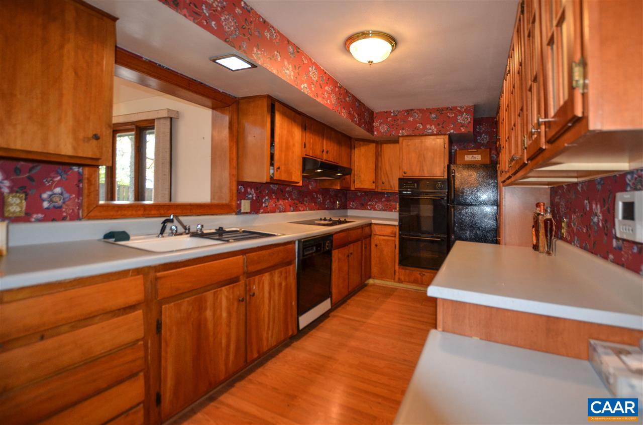 5770 Willow Spring Road Crozet, VA 22932 - Photo 22 of 49 a large kitchen with stainless steel appliances granite countertop a sink a stove and a refrigerator