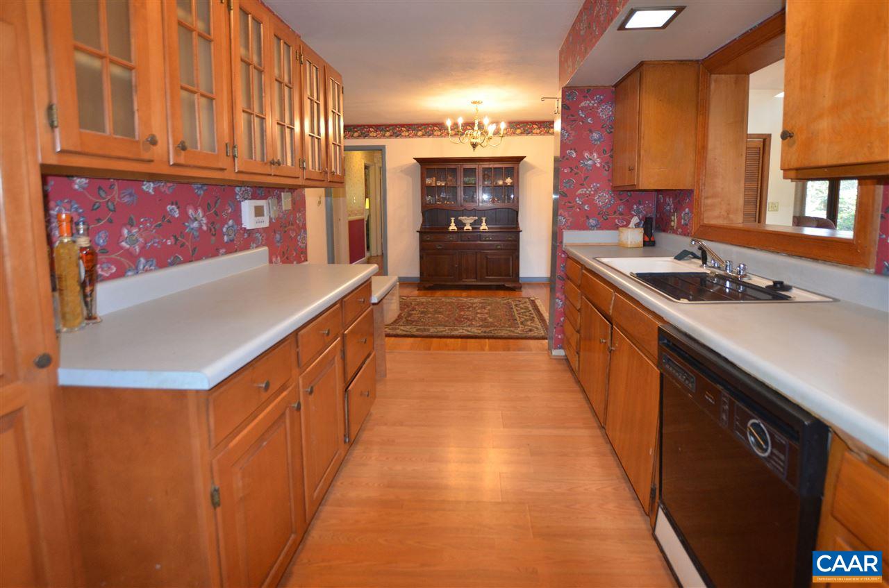 5770 Willow Spring Road Crozet, VA 22932 - Photo 23 of 49 a kitchen with stainless steel appliances granite countertop a sink and cabinets