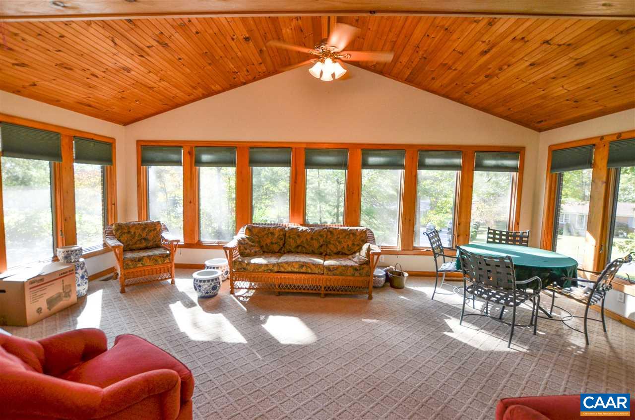 5770 Willow Spring Road Crozet, VA 22932 - Photo 24 of 49 a living room with furniture and floor to ceiling windows