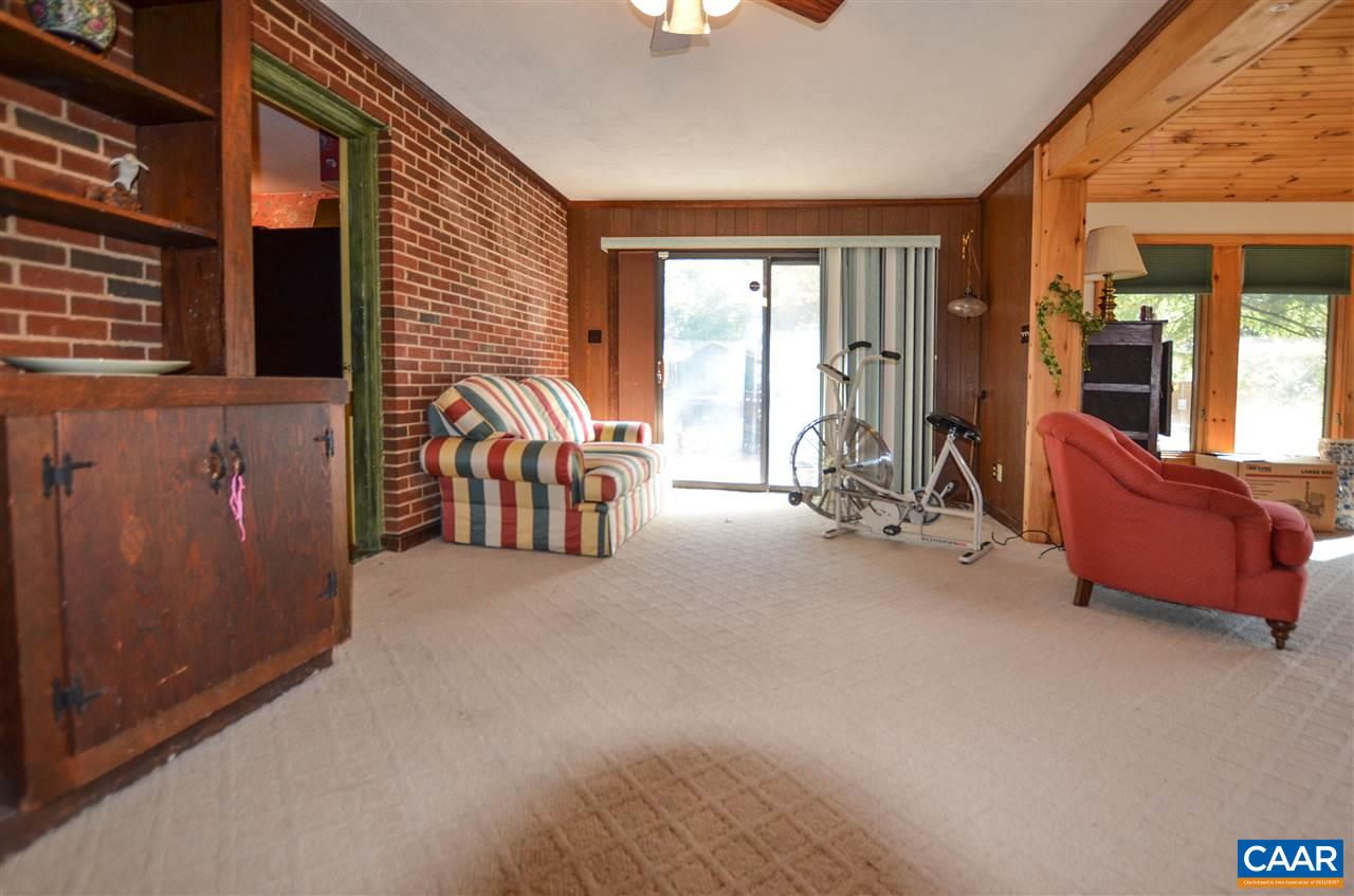 5770 Willow Spring Road Crozet, VA 22932 - Photo 26 of 49 a view of an empty room with a fireplace and windows