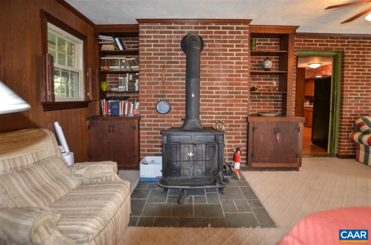 5770 Willow Spring Road Crozet, VA 22932 - Photo 27 of 49 a living room with furniture and a fireplace