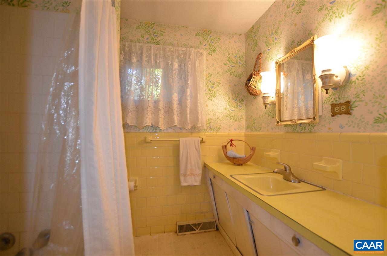 5770 Willow Spring Road Crozet, VA 22932 - Photo 33 of 49 a bathroom with a sink and mirror