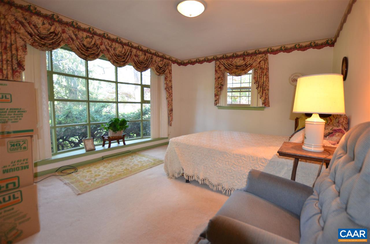 5770 Willow Spring Road Crozet, VA 22932 - Photo 34 of 49 a bed room with a bed and a couch