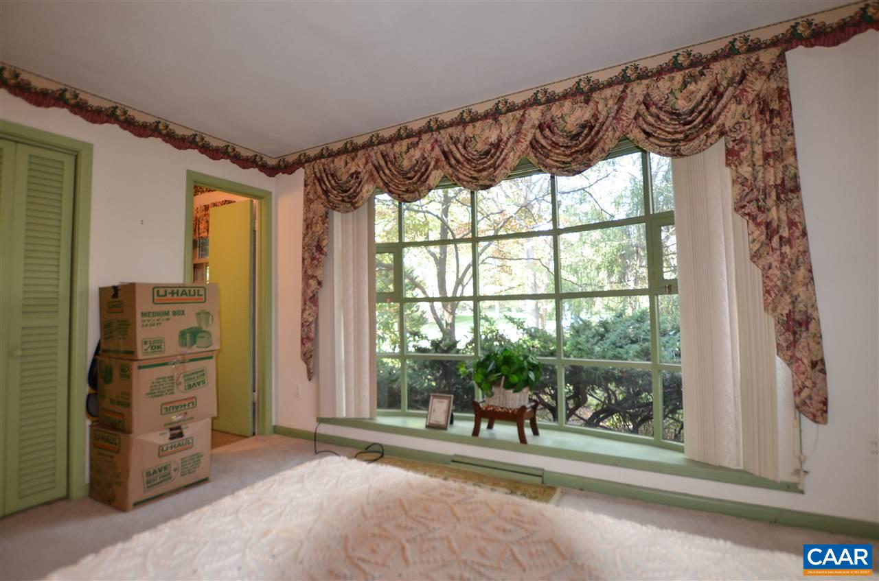 5770 Willow Spring Road Crozet, VA 22932 - Photo 36 of 49 a view of a porch with a furniture and floor to ceiling window