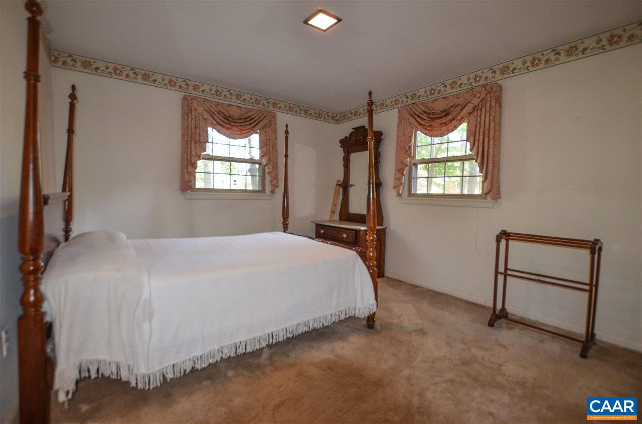 5770 Willow Spring Road Crozet, VA 22932 - Photo 38 of 49 a bedroom with a bed and a window