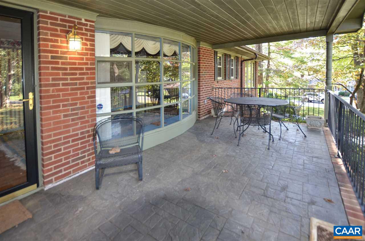 5770 Willow Spring Road Crozet, VA 22932 - Photo 6 of 49 a view of a porch with chairs and table in a patio