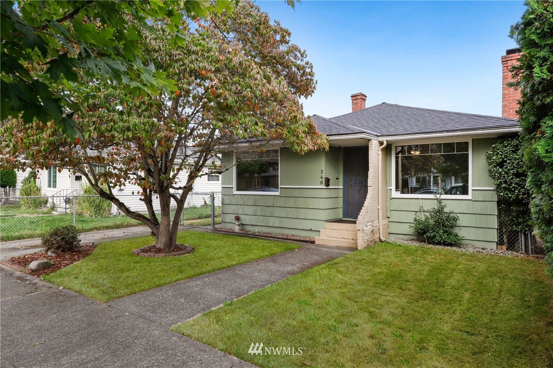 340 Wells Avenue North Renton, WA 98057 - Photo 1 of 23 a front view of a house with garden