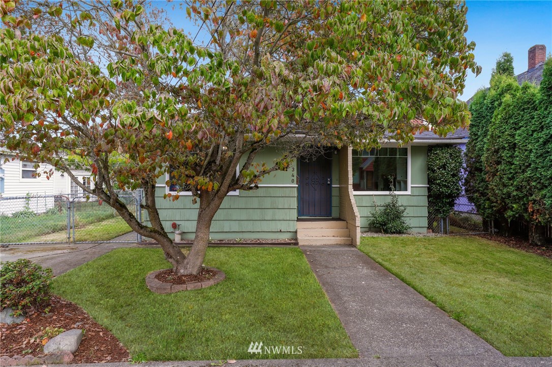 340 Wells Avenue North Renton, WA 98057 - Photo 2 of 23 a front view of a house with garden