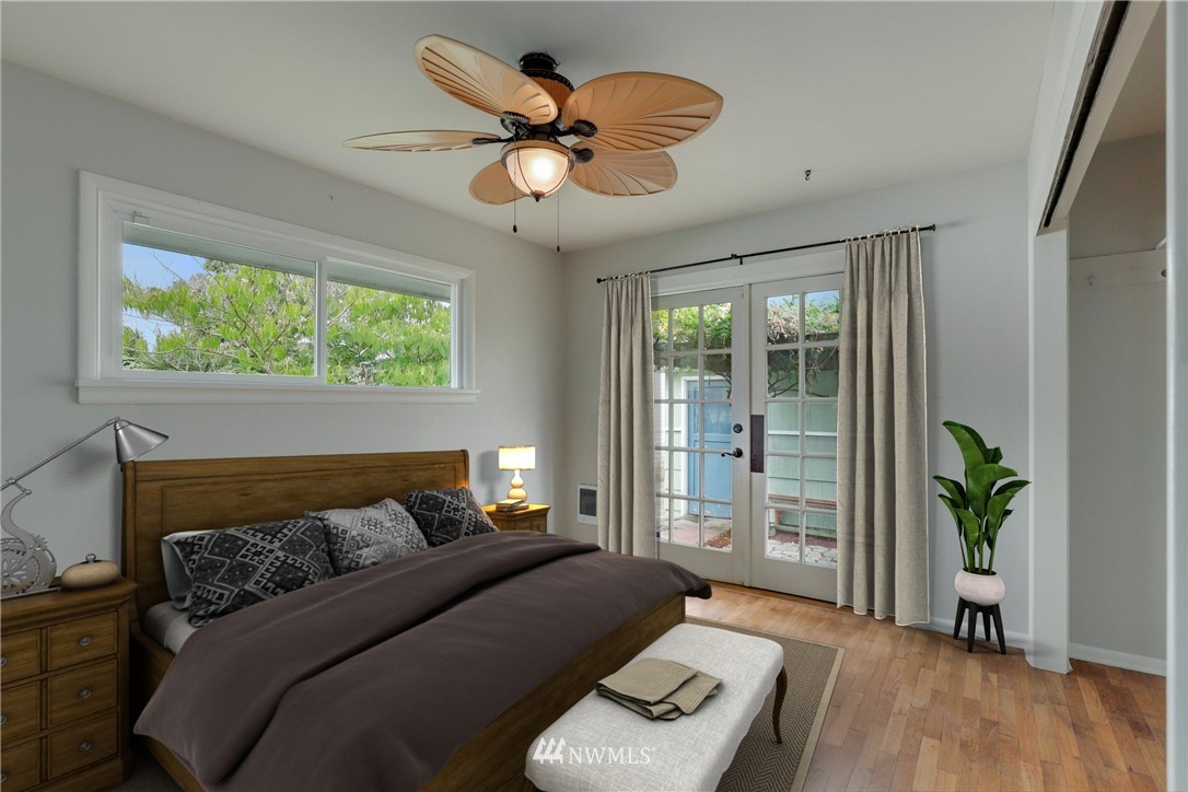 340 Wells Avenue North Renton, WA 98057 - Photo 12 of 23 a bedroom with a bed and a chandelier