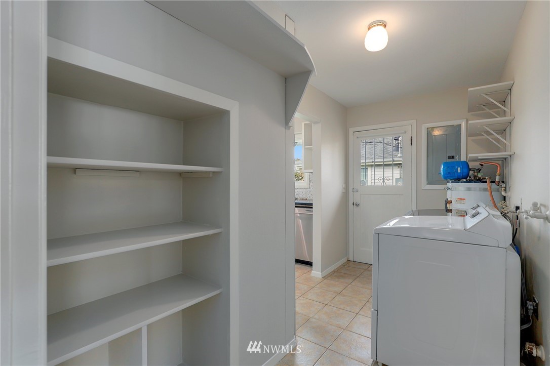 340 Wells Avenue North Renton, WA 98057 - Photo 15 of 23 a utility room with cabinets washer and dryer