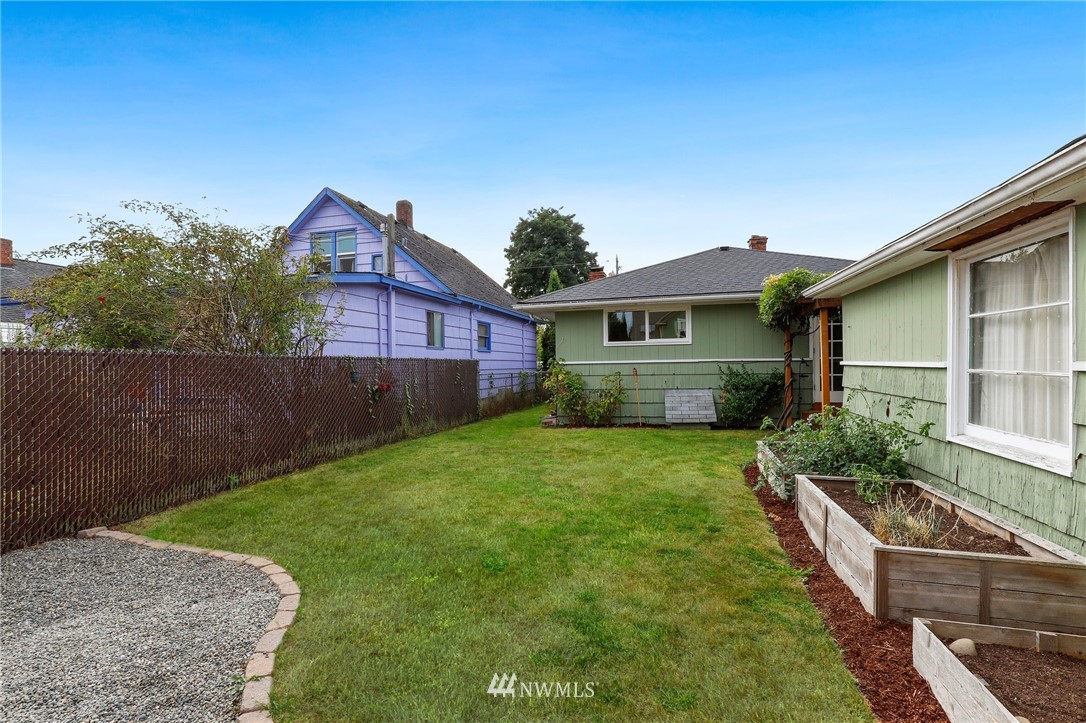 340 Wells Avenue North Renton, WA 98057 - Photo 19 of 23 a front view of a house with a yard