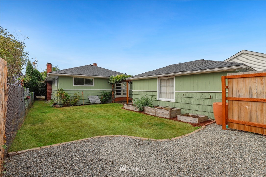 340 Wells Avenue North Renton, WA 98057 - Photo 20 of 23 a front view of a house with a yard and porch