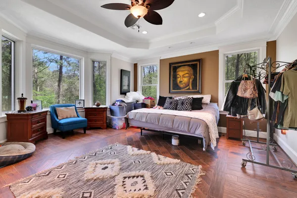 a bed room with furniture and a large window