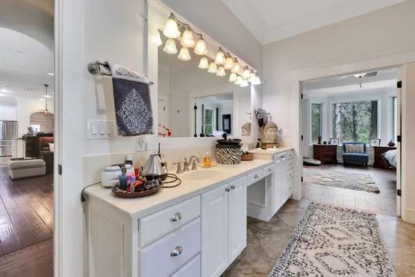a spacious bathroom with a double vanity sink and a mirror