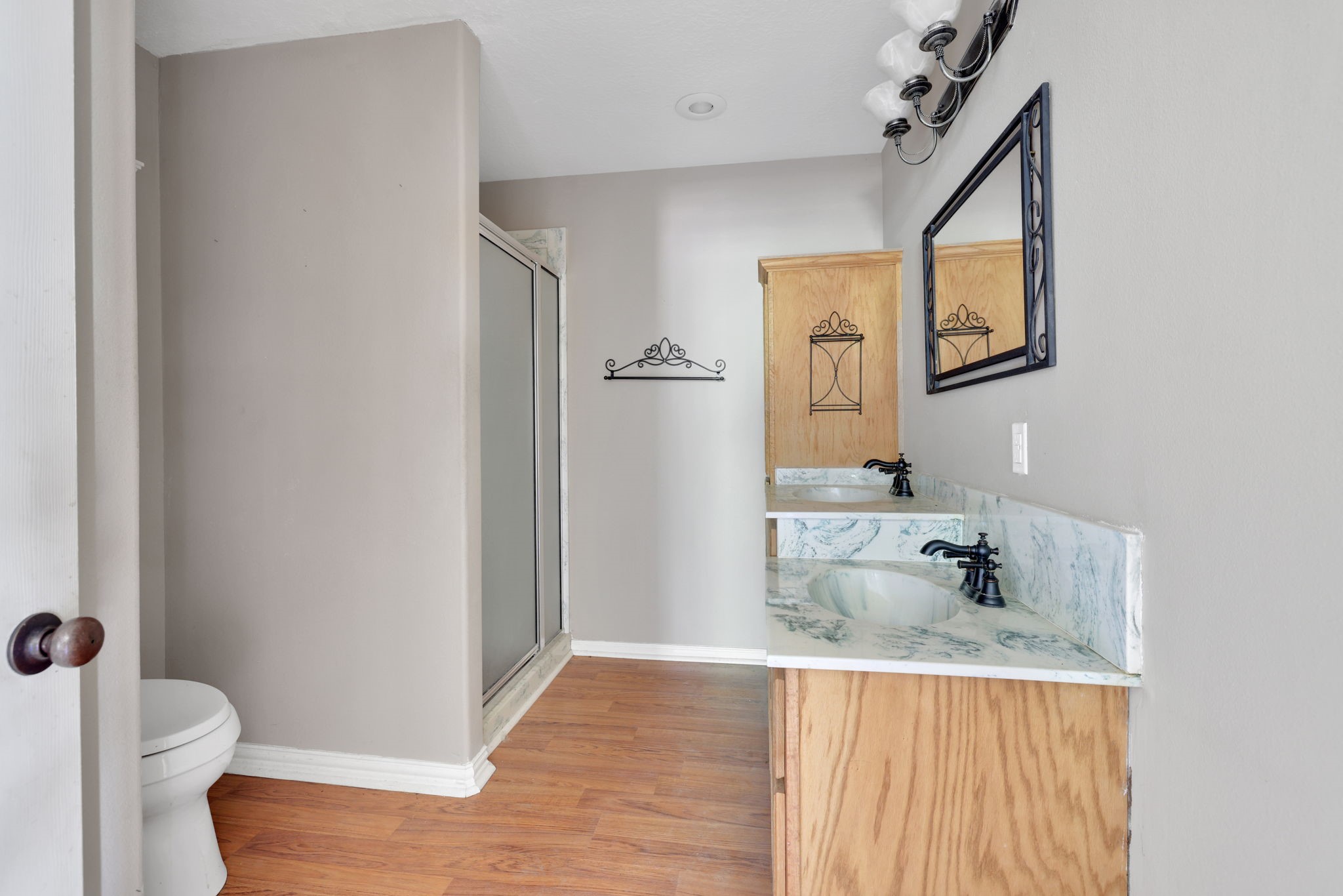250 Critter Creek Road Coldspring, TX 77331 - Photo 35 of 48 a bathroom with a granite countertop sink toilet and mirror