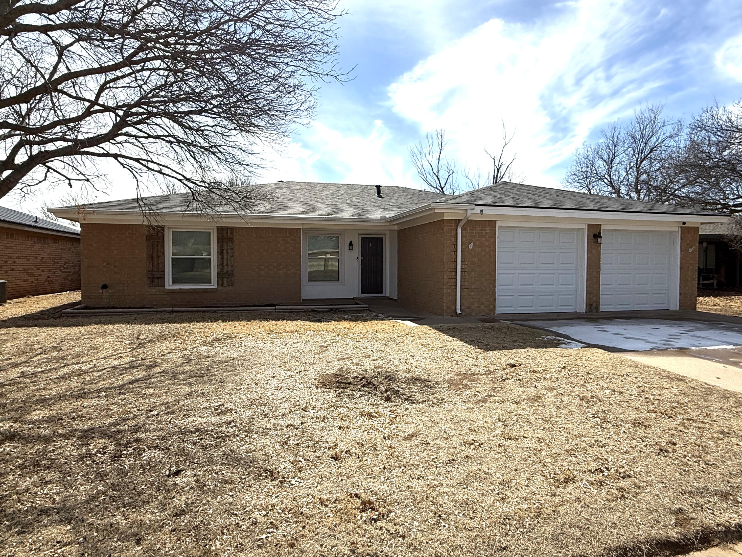 5729 89th Street Lubbock, TX 79424 - Photo 1 of 15 a front view of the house