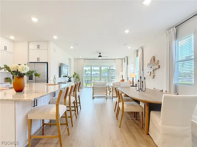 a view of a dining room with furniture window and outside view