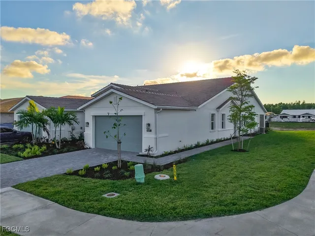 a aerial view of a house with a yard