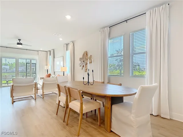a view of a dining room with furniture window and outside view